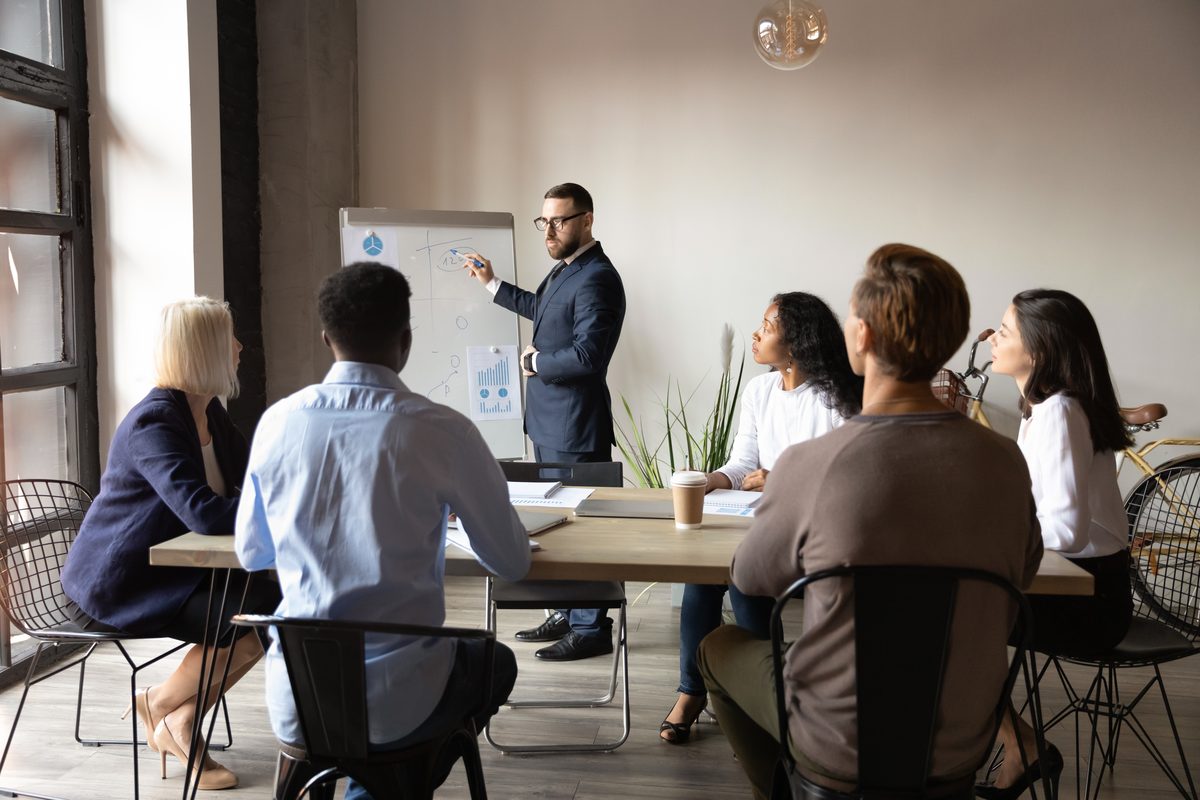 Business owners discussing their goals with a consultant